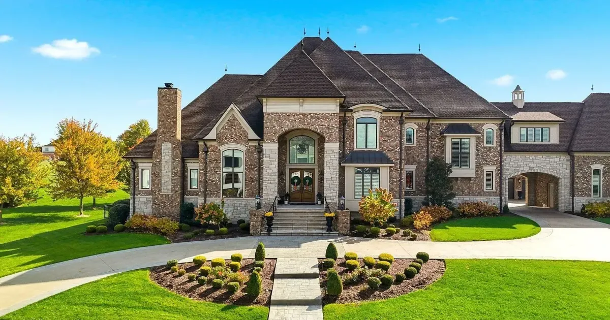 Brick and stone estate with manicured landscaping in Prospect, Kentucky