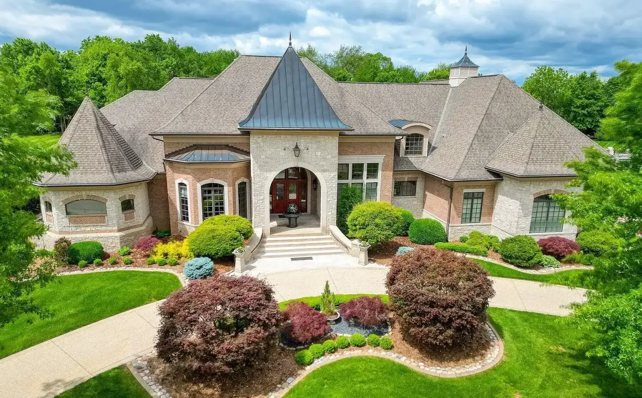 Stone estate with standing seam metal turret roofing in Prospect, Kentucky